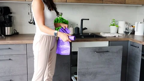 Young woman do replacing garbage bag in kitchen trash can. Housework concept. Stock Footage 276570181