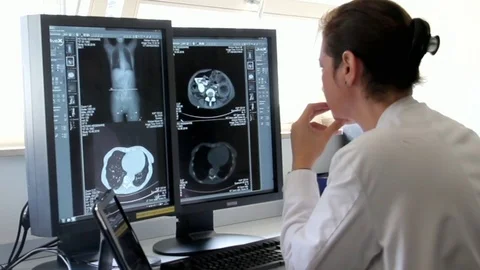 Young Woman Doctor Examines the Results of Patient Famale Breast Cancer Stock Footage
