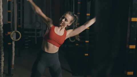 Young woman does stretching exercise Stock Footage 153088896