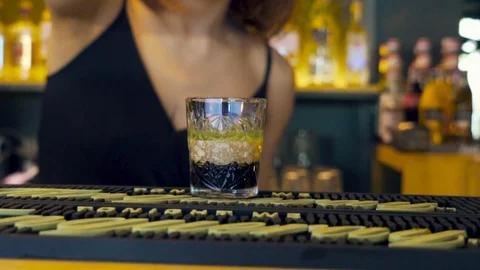 Young woman doing burning shots in the local pub Stock Footage