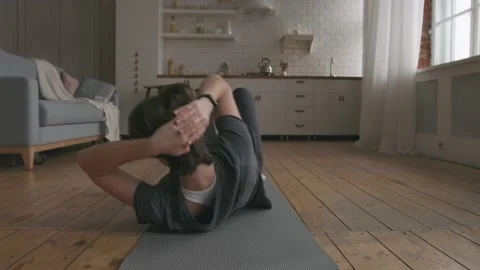 Young Woman Doing Core Workout Stock Footage 153124394