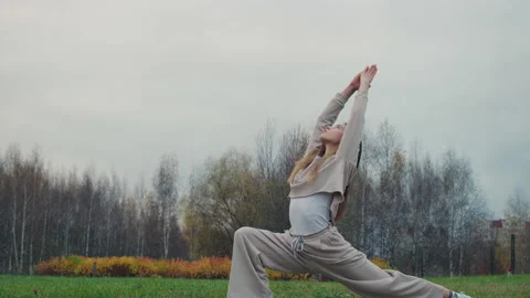 Young Woman Doing Exercise For Buttocks In Nature.Red Helium 8K Video stock 142948765