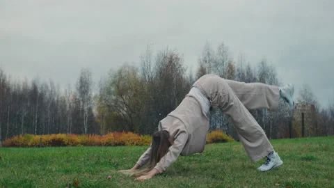 Young Woman Doing Exercise For Buttocks In Nature.Red Helium 8K Stock Footage 142950182