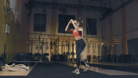 Young woman doing exercise Stock Footage 152932771