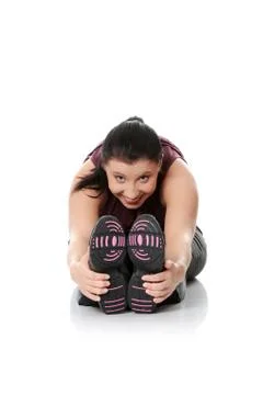 Young woman doing exercise Stock Photos