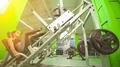 The young woman doing exercise in a sport club on a bright light background 4k or 4k+ Resolution