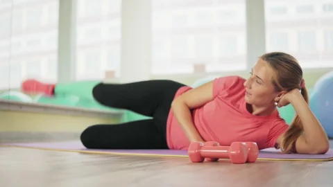Young woman doing exercises for buttocks. Stock Footage 88972969