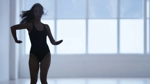 Young Woman Doing Forward Bends in a Gym Stock Footage 72126086