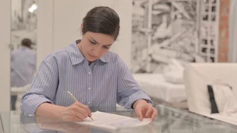 Young Woman Doing Paperwork, Checking Douments Video stock 238648390