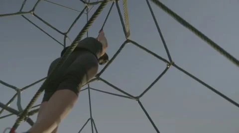 Young woman doing pull up in park Stock Footage 63632361