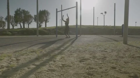 Young woman doing pull-ups Stock Footage 63721983