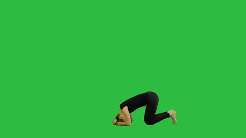 Young woman doing sirsasana yoga pose on a Green Screen, Chroma Key Stock Footage