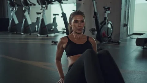 Young woman doing sit ups stomach, crunches workout class in gym. Healthy l.. Stock Footage 249648649