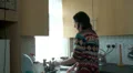 young woman doing the washing up at home HD Footage