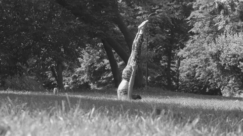 Young woman doing yoga exercises Stock Footage
