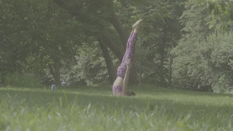 Young woman doing yoga exercises Stock Footage