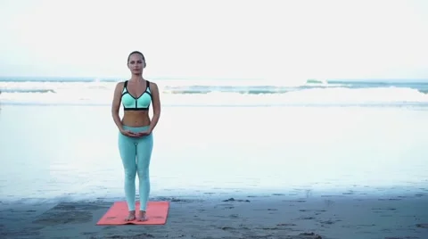Young woman is doing yoga. Stock Footage 61807853