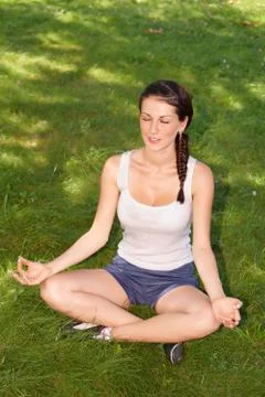 Young woman doing yoga Stock Photos