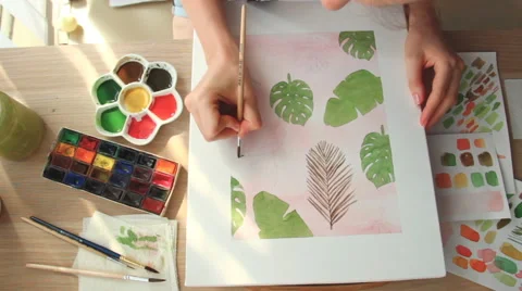 A young woman draws a pattern. Time lapse Stock Footage 67376518