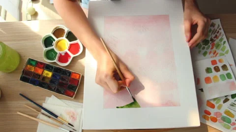 A young woman draws a pattern. Time lapse Stock Footage 67376562