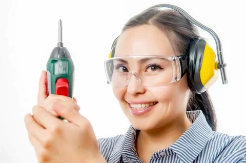 Young woman with a drill Stock Photos