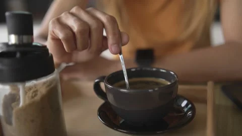 Young woman is drinking coffee in a cafe Stock Footage 198296658