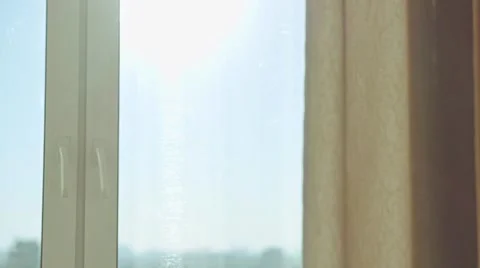 Young woman drinking coffee by the window during sunrise in her cozy home. Stock Footage 51134822