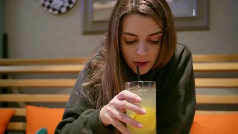 Young woman drinking lemonade Stock Footage 219732895