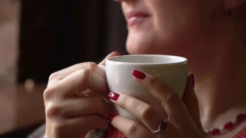 Young woman drinking tea at camera Stock Footage 76505728