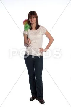 Young woman with a duster isolated on white background Stock Photos
