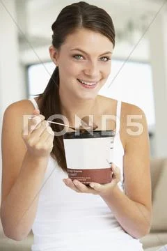 Young Woman Eating Chocolate Ice-Cream Stock Photos