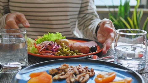 Young woman eats at table beautiful delicious breakfast in hotel, cafe Stockbeeldmateriaal 217737074