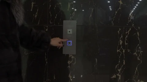Young woman in elevator Stock Footage 69995830