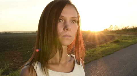  Young Woman on empty road Stock Footage 54053982