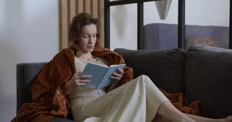 Young woman is engaged in self-development reading books Vidéo 162377223