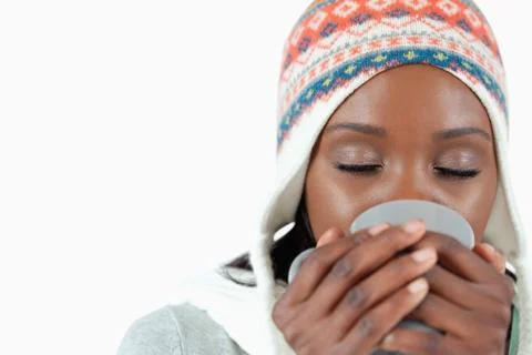 Young woman enjoying a cup of tea in the cold Stock Photos