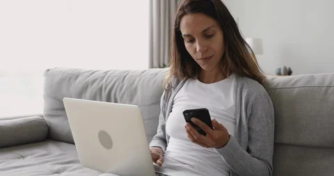 Young woman entering promo code from sms. Stock Footage 122739340