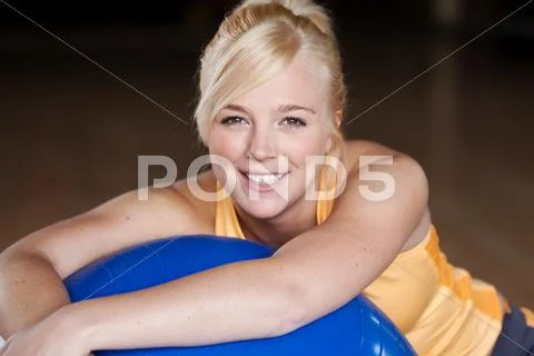 Young woman with exercise ball Stock Photos