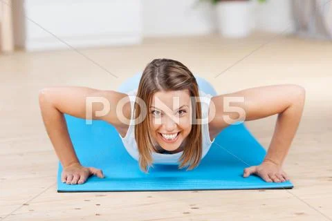 Young woman exercising and laughing Stock Photos