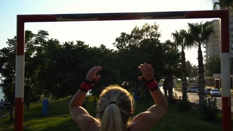 Young Woman Exercising Pull-ups Stock Footage 94114564