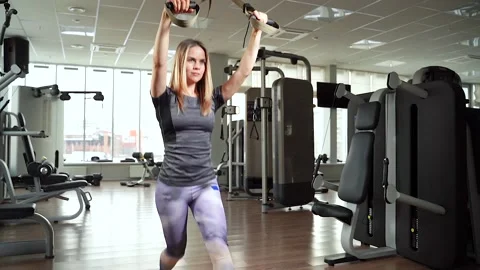 Young woman exercising workout using fitness straps TRX in the gym. Stock Footage 101505150