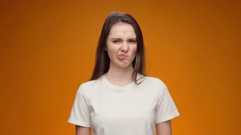 Young woman expressing aversion, rejection, negative attitude against yellow Stock Footage 149166230