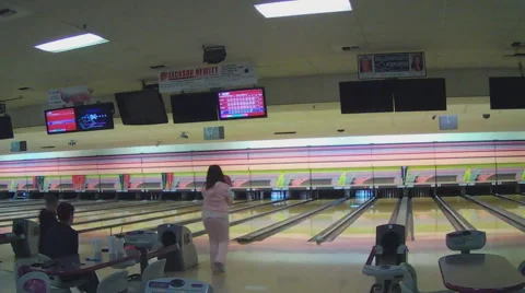 Young Woman With Family At Bowling Alley Stock Footage
