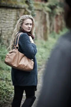 Young Woman Feeling Threatened As She Walks Home Stock Photos
