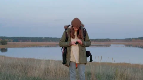 Young woman in the forest using compass for navigation. Stock Footage 140449944