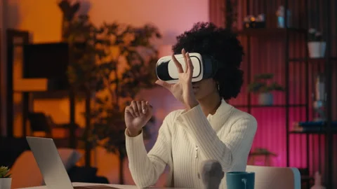 Young woman game designer testing VR headset, using interactive technology Stock Footage 306284615
