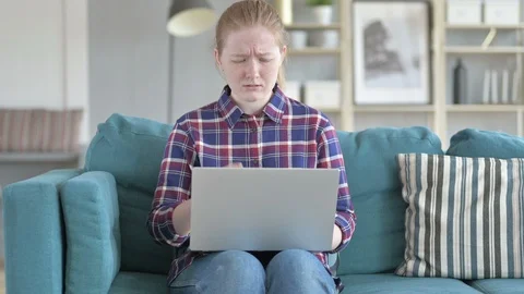 Young Woman getting Angry While Using Laptop Stock Footage 114781196