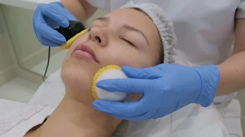 Young woman getting microcurrent therapy procedure for beautiful facial skin. Видео 221160309