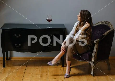 Young Woman With A Glass Of Wine