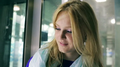 Young woman going down using elevator 스톡 동영상 41249128